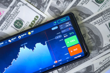 Business and Financial Concept. Online trading with chart display on smartphone with graph