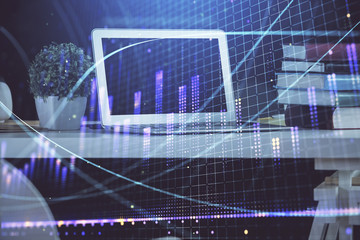 Forex market chart hologram and personal computer background. Double exposure. Concept of investment.