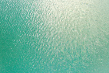 Blue sea water texture calm and peaceful background top view