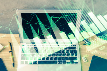 Multi exposure of graph and financial info and work space with computer background. Concept of international online trading.