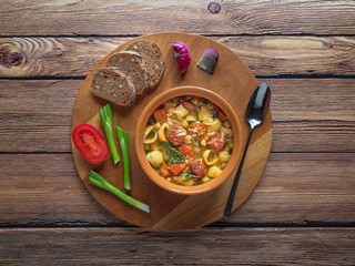 Hot soup with chickpeas and chorizo sausage