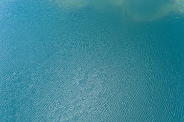 Fototapeta na wymiar Blue sea water texture calm and peaceful background top view