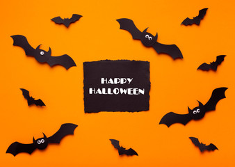 Happy Halloween concept with flying bats and text