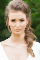 Fototapeta premium Portrait of beautiful bride with beautiful hairstyle and makeup