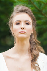 Fototapeta premium Portrait of beautiful bride with beautiful hairstyle and makeup