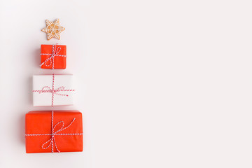 Christmas tree of presents with star on the top on white