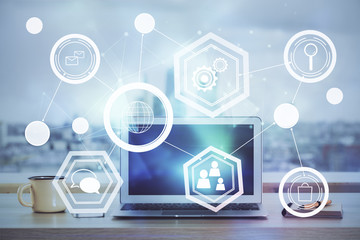 Computer on desktop with social network theme icon. Multi exposure. Concept of international connections.