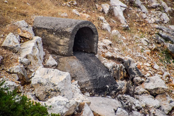 Concrete tunnel for draining sewage under road.