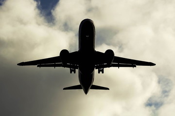 passenger aircraft in the sky at approach