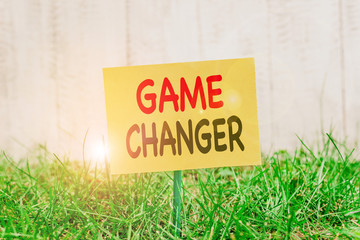 Writing note showing Game Changer. Business concept for way that effects a major shift in the...