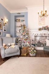 02.02.2019, Saint-Petersburg, Russia, beautiful modern design of the room in delicate light colors decorated with Christmas tree,decorative elements.interior design, magic atmosphere. pastel colors