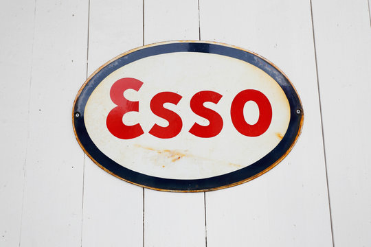 Lugner, Sweden - July 9, 2018: Old Esso gasoline brand logo sign on a wooden wall.