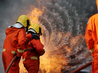 firefighter spray water to fire burning car workshop fire training