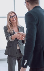 business man meets a woman with a handshake