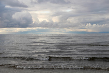 Large waves of sea and dark clouds