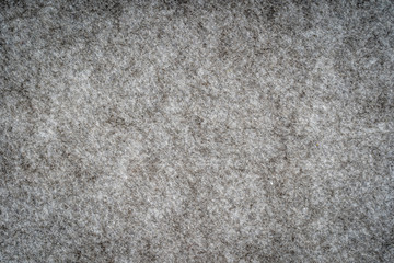 Grey heather knitted fabric made of synthetic fibres textured background. Grey knitted fabric texture. Background with delicate striped pattern