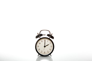 black vintage alarm clock time 2 hours isolated on white background