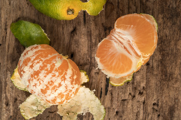 peeled tangerine on a wooden table