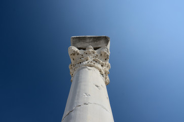Ancient Greek column against the blue sky