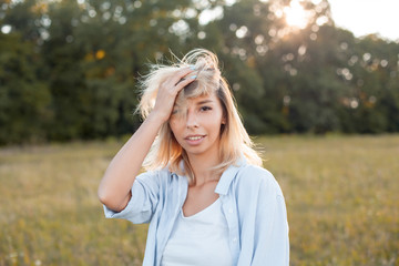 Playful young woman walking outdoors under sunlight