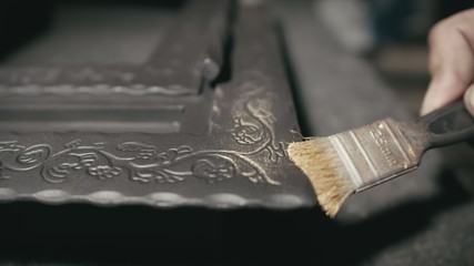 Forge workshop. The product is artificially aged. Gold powder painting of scratches, roughness and...