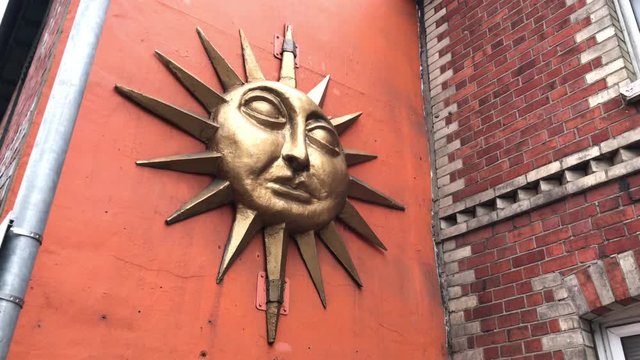 Mascaron of a shining sun 