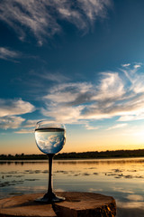 glass of water at sunset
