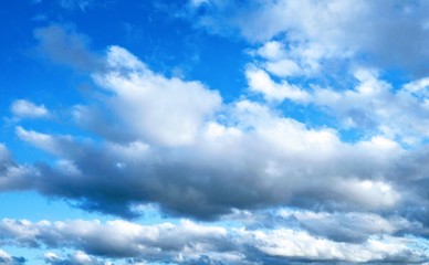 Fototapeta na wymiar White Clouds on a Clear Blue Sky