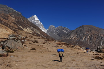 Nepal. Himalayan mountains. Snowy peaks of the Himalayas. Alpine glacial lakes. Snowy mountain peaks against the blue sky.