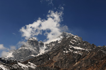 Fototapeta na wymiar Nepal. Himalayan mountains. Snowy peaks of the Himalayas. Alpine glacial lakes. Snowy mountain peaks against the blue sky.