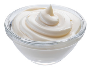 Mayonnaise swirl in glass bowl. Clipping path.