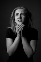 Portrait of scared young woman. Black and white