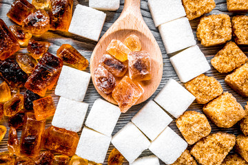 sugar lumps for sweet food cooking on kitchen gray table top view pattern