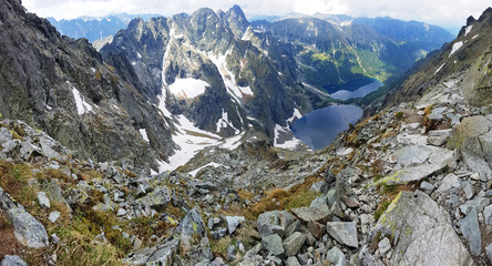 Morskie Oko. High Tatras, Poland, May 27, 2018. Beautiful landscape of snowy mountain tops and the lake between them. © volff