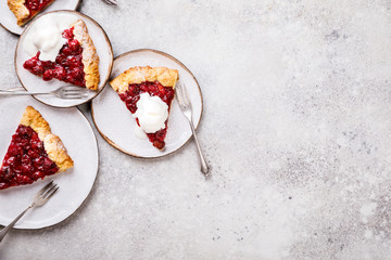 Bakery products. Summer pie with berries. Galeta with cherry sprinkled with powdered sugar. Copy space.