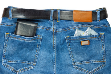 Credit cards with a wallet in jeans pockets.