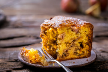 Apple pie on a wooden background. Fragrant autumn baking.
