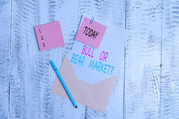 Conceptual hand writing showing Bull Or Bear Market Question. Concept meaning asking someone about...