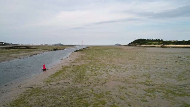 Aerial view. Channel fairway navigation marks during low tide in the town of Paimpol in Northern France, in Brittany.