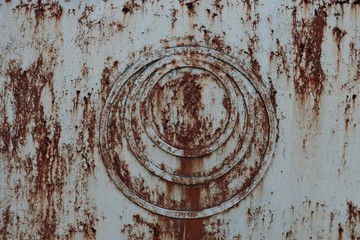 iron rusty surface to which iron rusty rings are attached