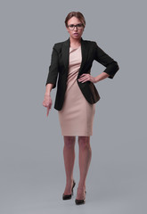 Fototapeta premium strict businesswoman pointing down. isolated on white