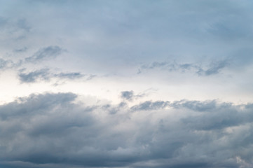 Dark gray clouds. Cloudy rainy windy sky in the evening.