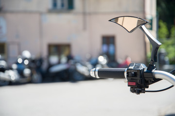 Accelerator command on a motorbike on a blurred background, with copyspace