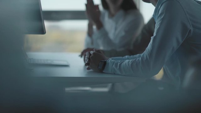 Three young modern businessmen talk about the window, discuss work issues. Two men of the businessman and the beautiful girl communicate on business subjects. Meeting, dress code.