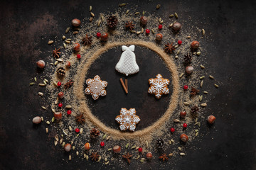 Brown sugar, gingerbread and Christmas spices in the shape of a watch dial. Five minutes to twelve. Christmas Eve, New Year.