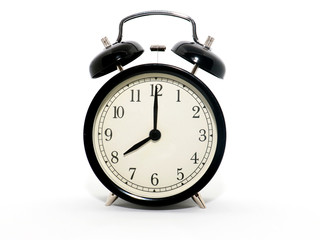 Old-style alarm clock, black and white, it's eight o'clock.