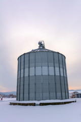 Silo on rural farm in winter.