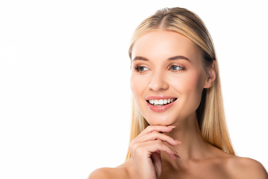 smiling blonde woman with white teeth looking away isolated on white