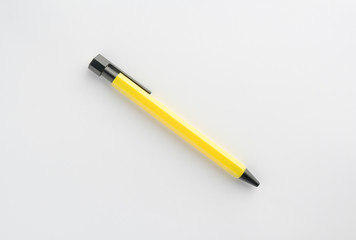 Yellow pen on white background