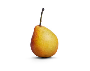 A golden ripe pear isolated against a white background.